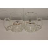 Pair of Guinness advertising tankards.