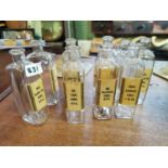 Nine clear glass chemist bottles