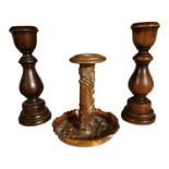 Pair of turned mahogany candlesticks