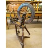 Early 20th C. oak spinning wheel.