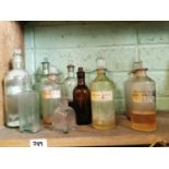 Twelve 19th. C. glass chemist's bottles