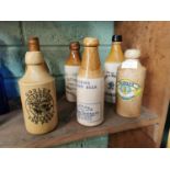 Six 19th. C. stoneware ginger beer bottles