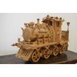 Fine quality carved wooden model of a steam engine .