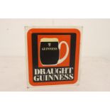 Draught Guinness advertising board.