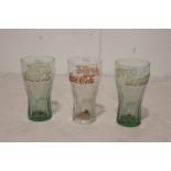 Three Coca Cola advertising glasses.