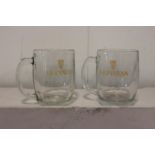 Pair of Guinness advertising tankards.