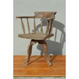 19th C. pine revolving captains chair.