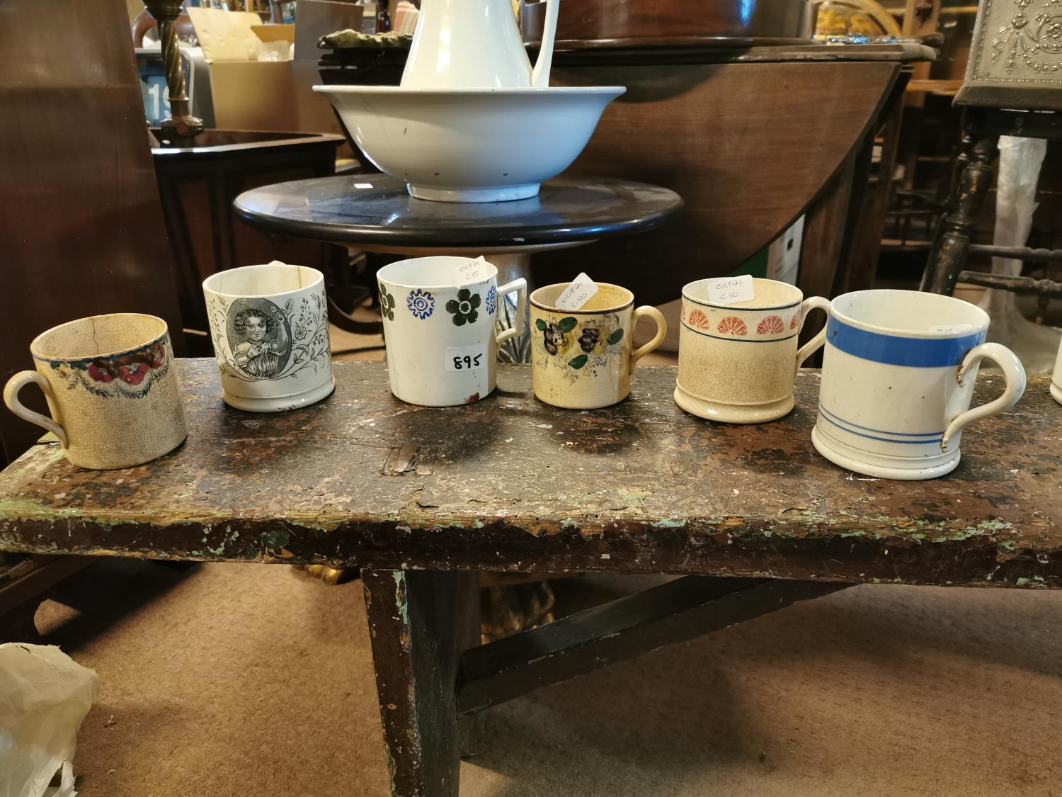 Six 19th C. transfer and spongeware mugs.