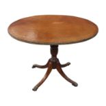 Mahogany wine table with brass paw feet