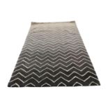 Grey geometrical design rug.