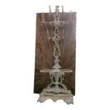 Cast iron coat and stick stand