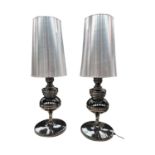 Pair of decorative polished metal lamps