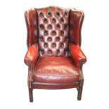Good quality ox blood leather upholstered wing backed armchair