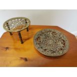 Decorative brass wall plaque and trivet.