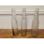 Three Esso Essolube oil bottles