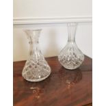 Two crystal carafes.