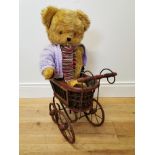Merrythought teddy and pram