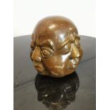 Bronzed Buddhas head paper weight.