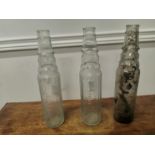 Three Esso Essolube oil bottles