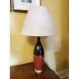 Ceramic table lamp with shade.