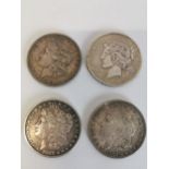 Four 19th. C. & early 20th. C. US silver dollars