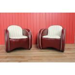 Pair of red and cream leather chairs.