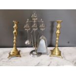 Pair of brass candlesticks and a chrome companion set