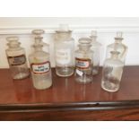 Collection of eight glass chemist bottles.