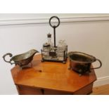 Cruet set and two silverplate gravy boats.