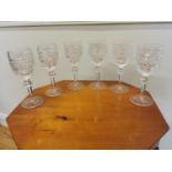 Six Waterford Crystal wine glasses.