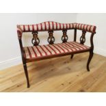 Art Nouveau upholstered mahogany and satinwood two seater bench