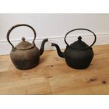 Two early 20th. C. cast iron kettles.