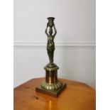 Brass candle stick in the Grecian style.