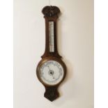 Edwardian carved oak barometer.