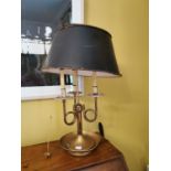 Brass and metal three branch table lamp.