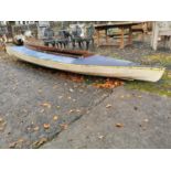 1950s canvas and timber canoe.