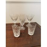 Five Waterford crystal glasses.