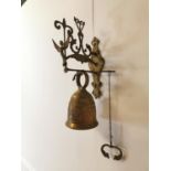 Decorative brass wall bell.