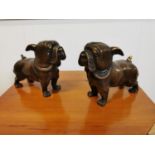 Pair of bronze models of pug dogs.