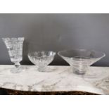 Two Waterford crystal vases and another glass vase.