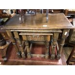 OAK NEST OF THREE TABLES AND A FOLDING THREE PLATEAU CAKE STAND