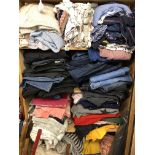 FOUR SHELVES OF VARIOUS LADIES CLOTHING INCLUDING DENIM JEANS, WOOLENS, SCARVES,