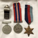 THREE WWII MEDALS INCLUDING A DEFENCE MEDAL AND AN ACME THUNDERER WHISTLE