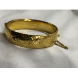 9CT GOLD METAL CORED ENGRAVED BANGLE,