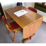 1970S FORMICA DROP FLAP KITCHEN TABLE AND TWO RED VINYL COVERED CHAIRS