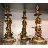 THREE GILDED CHERUB FIGURAL CANDLE HOLDERS CONVERTED TO ELECTRICITY 31CM H