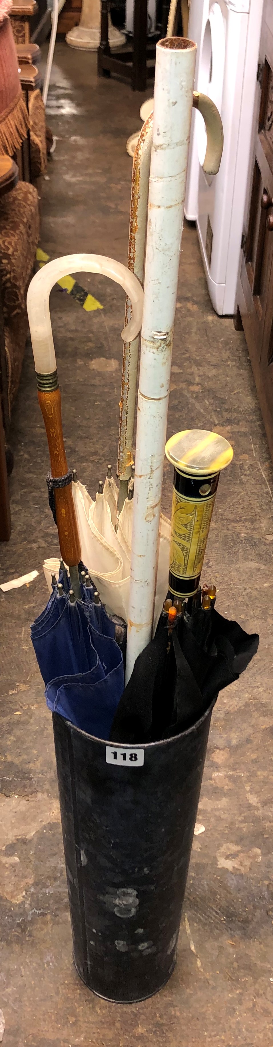 TAPERED STICK STAND CONTAINING VARIOUS PARASOLS