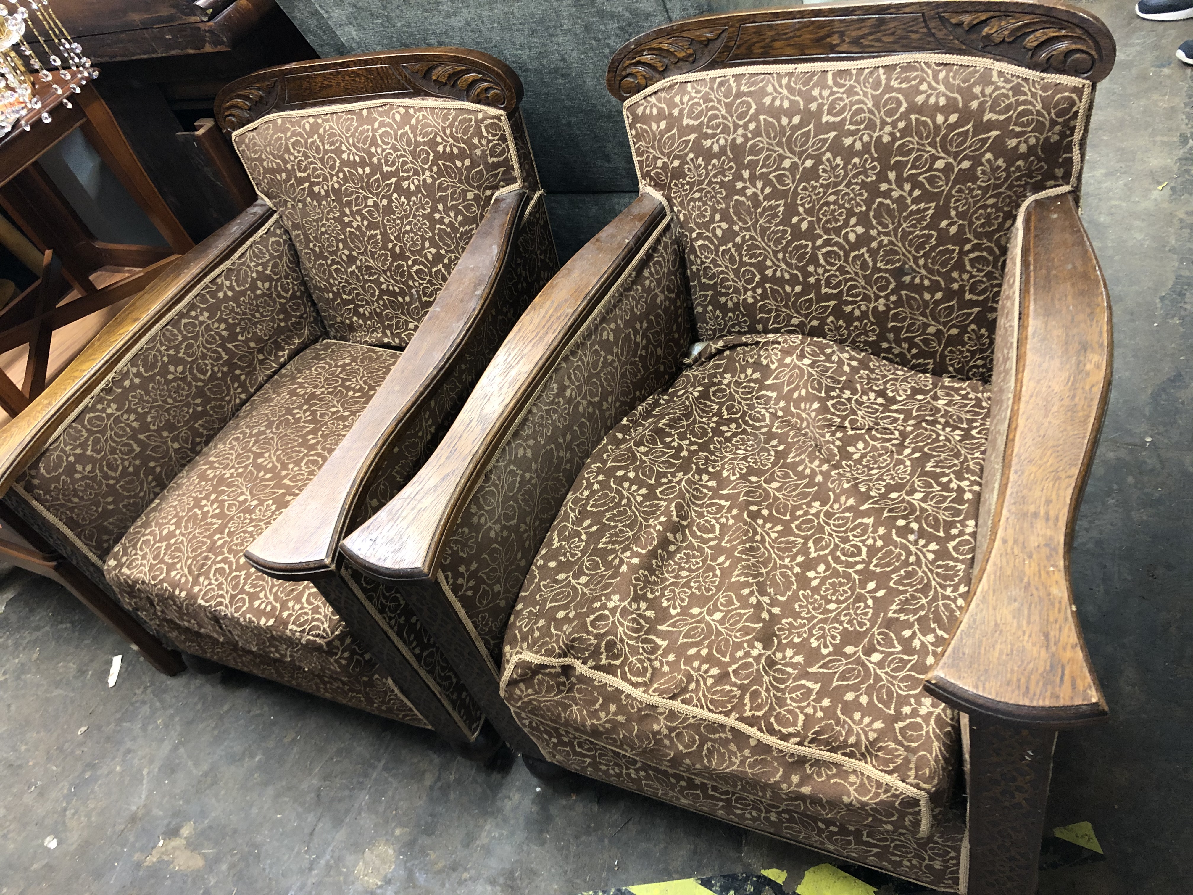 PAIR OF EDWARDIAN CARVED OAK FRAMED MOQUETTE ARMCHAIRS