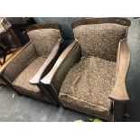 PAIR OF EDWARDIAN CARVED OAK FRAMED MOQUETTE ARMCHAIRS