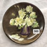 PORCELAIN PLATE HAND PAINTED WITH VASE OF YELLOW ROSES BY E.